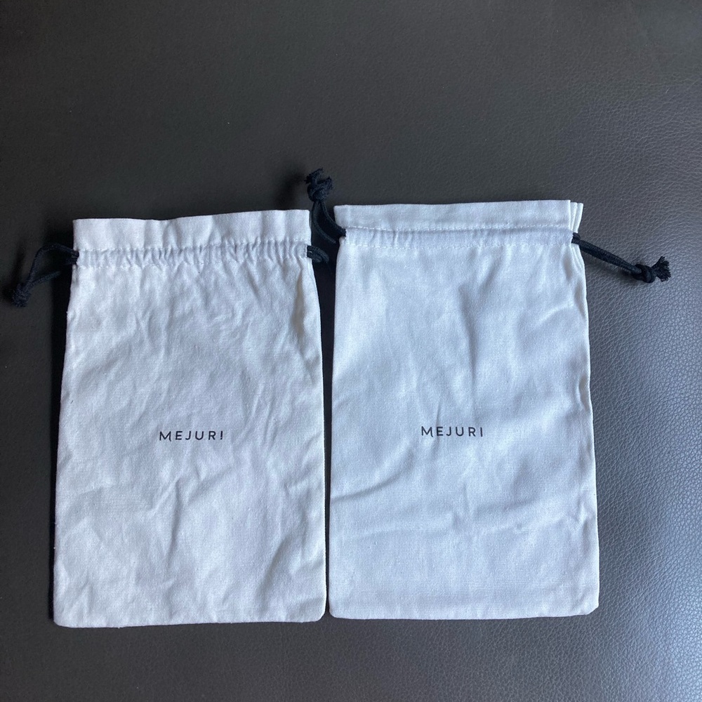 Two Mejuri  jewelry dust bag .